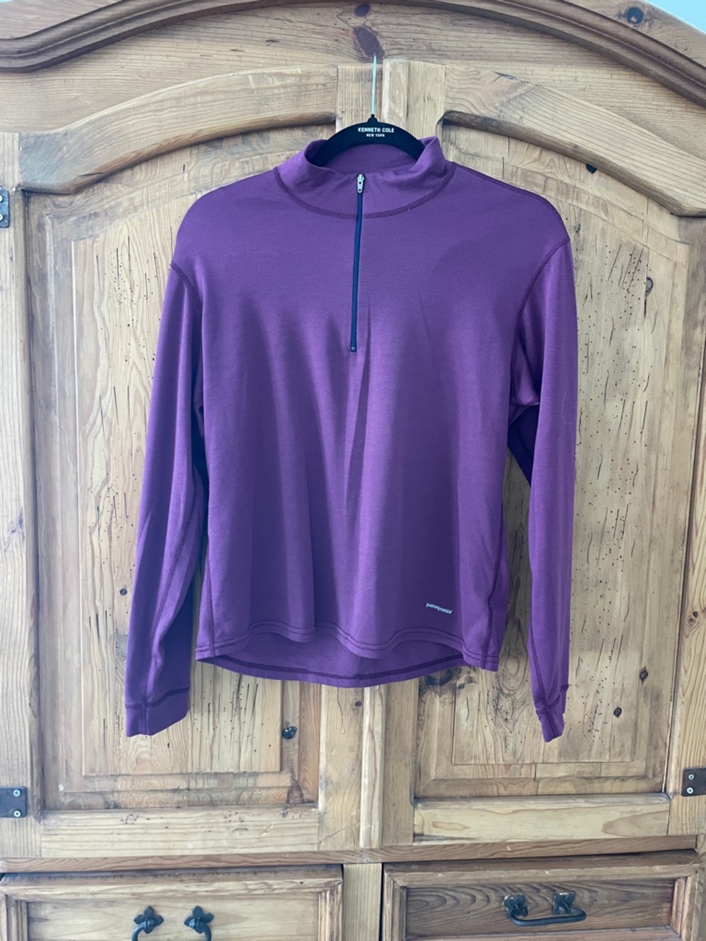 Women’s Patagonia maroon/ purple quarter zip.